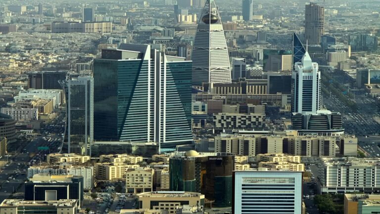 Gulf city skyline of modern skyscrapers, illustrating the IMF Gulf forecast for GCC economies in 2026