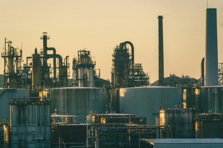 Oil and gas processing plant at sunset, illustrating the OQEP sukuk programme in Oman