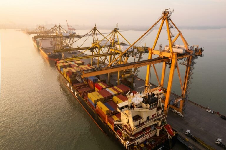 Cargo ship being loaded at a container port, illustrating the UAE-Thailand CEPA trade agreement