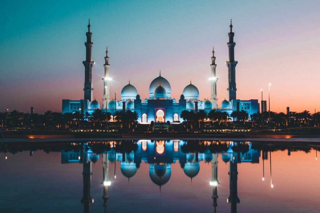 Apollo Mubadala Capital stake – Abu Dhabi skyline at sunset