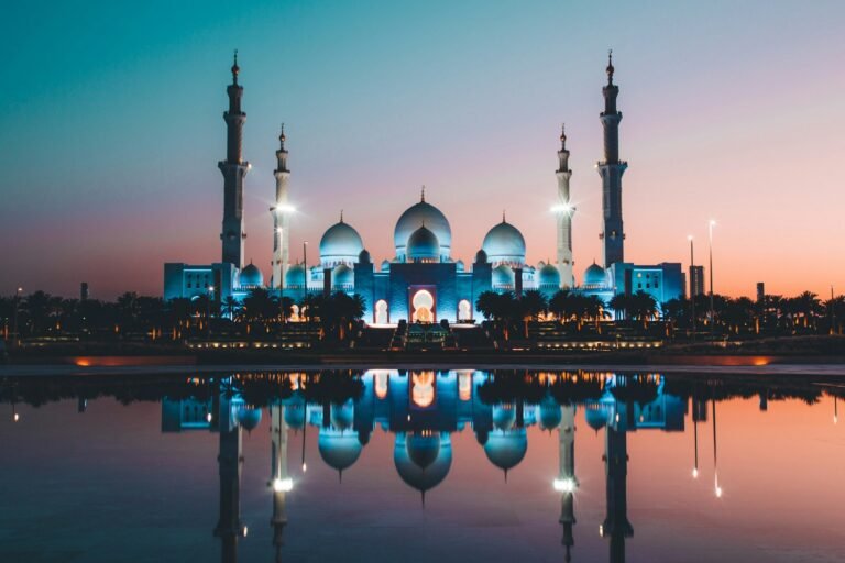 Apollo Mubadala Capital stake – Abu Dhabi skyline at sunset