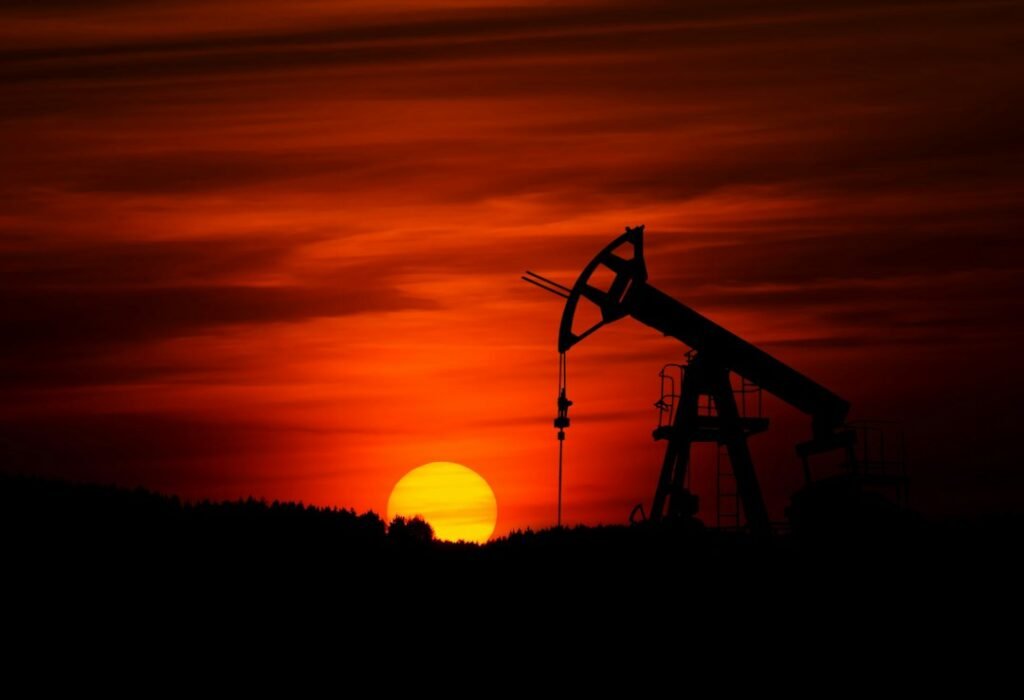ADNOC Drilling results – oil pump jack at sunset